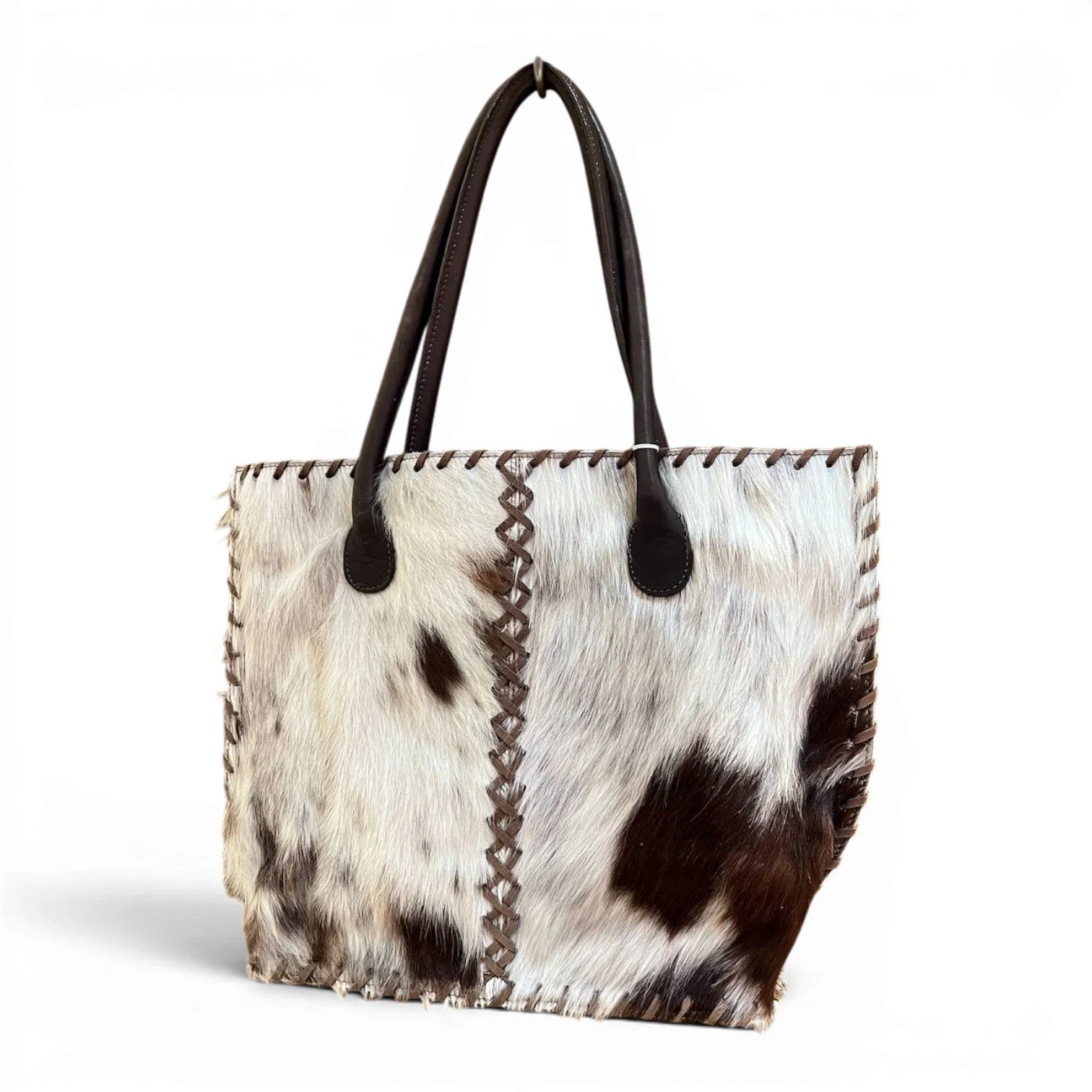 Handmade Brazilian Cheyenne cowhide tote bag with leather handles and detailed stitching