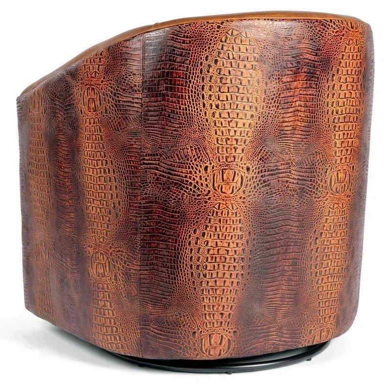The Weston Croc Swivel Chair features premium top-grain leather, croc-embossed accents, and smooth swivel functionality for refined Western-modern comfort.