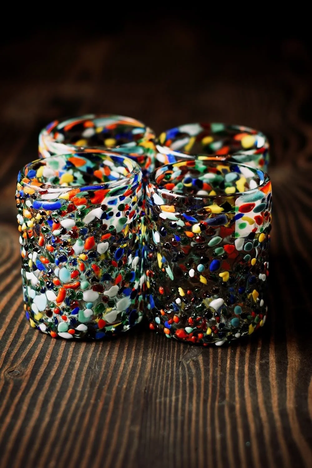 Shop a handblown Guanajuato tumbler from Mexico. Colorful confetti glassware perfect for everyday drinks, entertaining, and unique table settings.