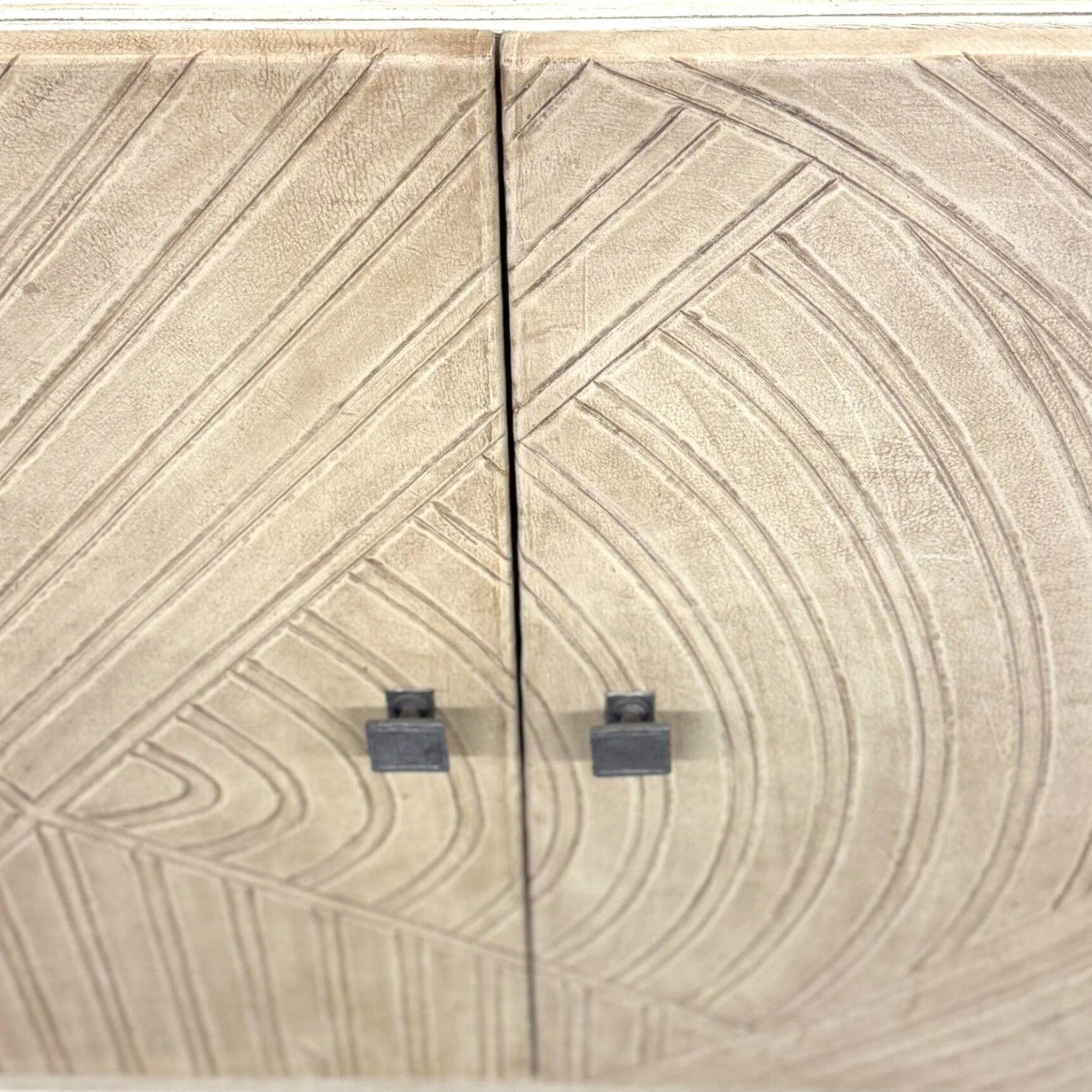 Handmade wood buffet with cream leather doors and carved geometric pattern