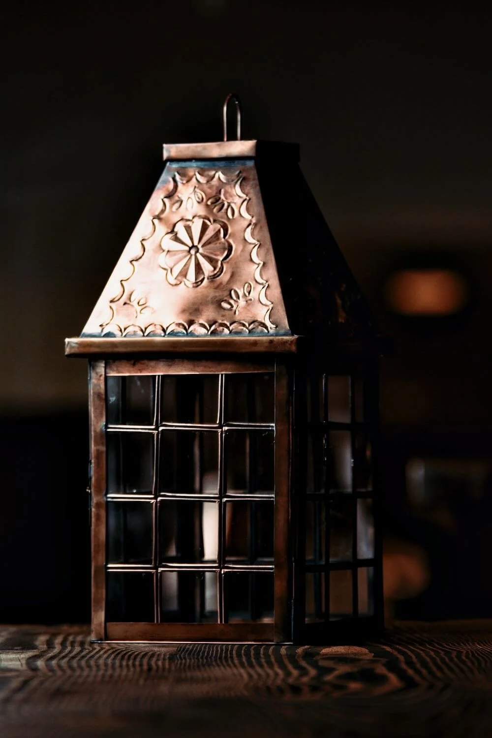 Linternas de Bronce - Shop handmade bronze lanterns from Mexico with glass panels and punched tin design. Elegant rustic lighting for tabletop or hanging display.