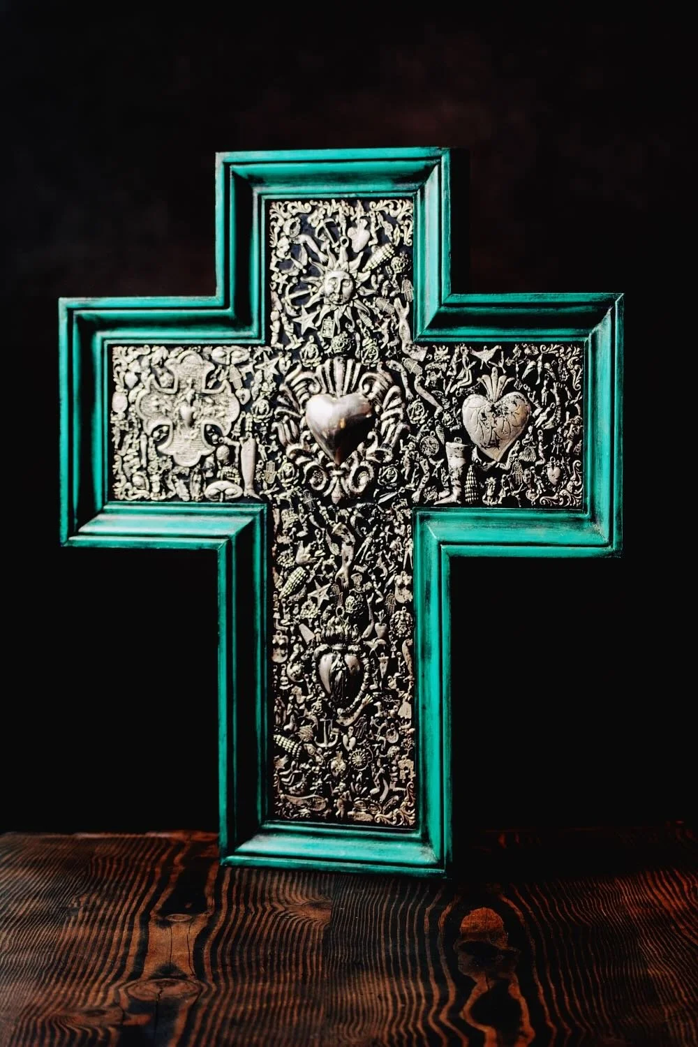 Cruz Milagros Grande Turquesa - Shop a large handmade Milagros cross from Mexico. Turquoise wooden wall decor with symbolic charms and rustic artisan craftsmanship.