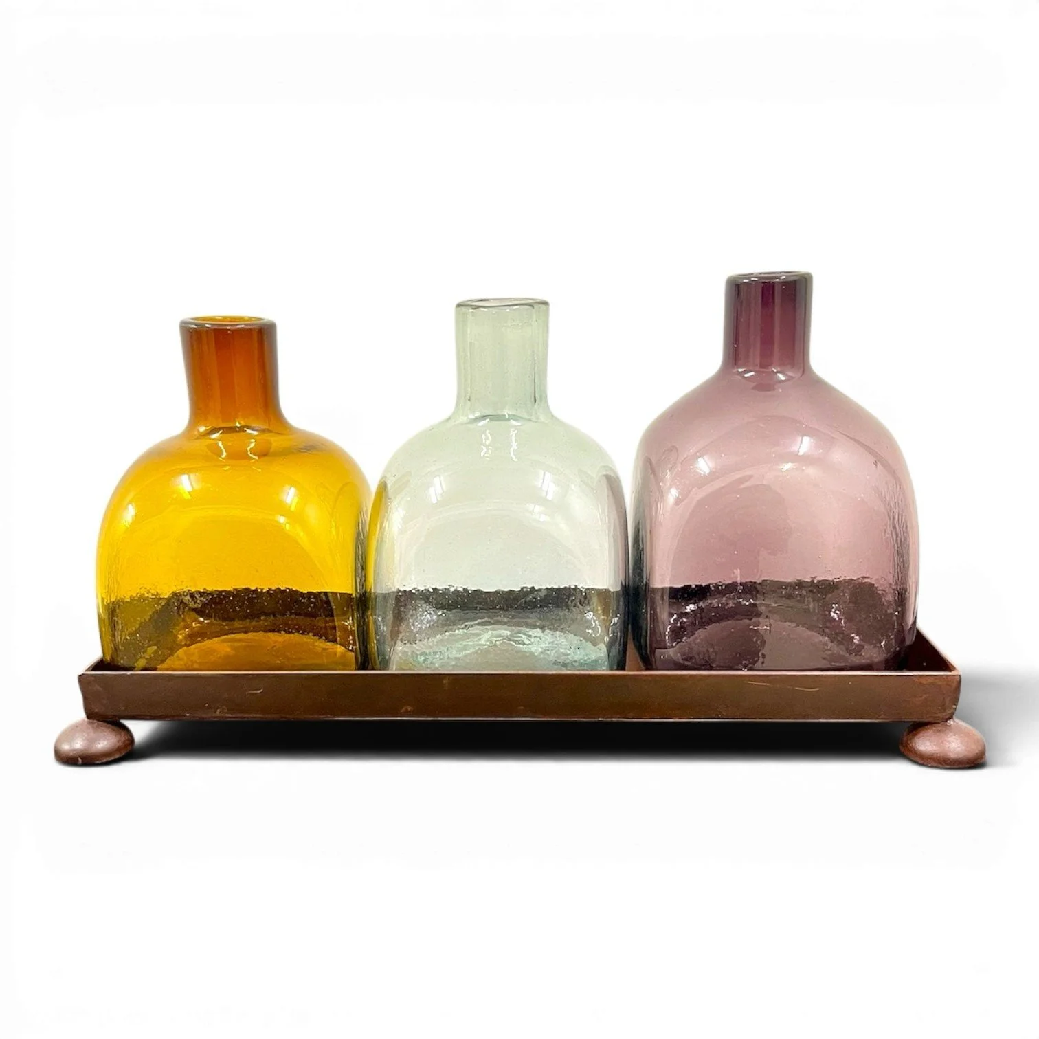 Handmade Mexican serving set featuring three handblown glass bottles and a handcrafted iron tray, perfect for entertaining and rustic décor.