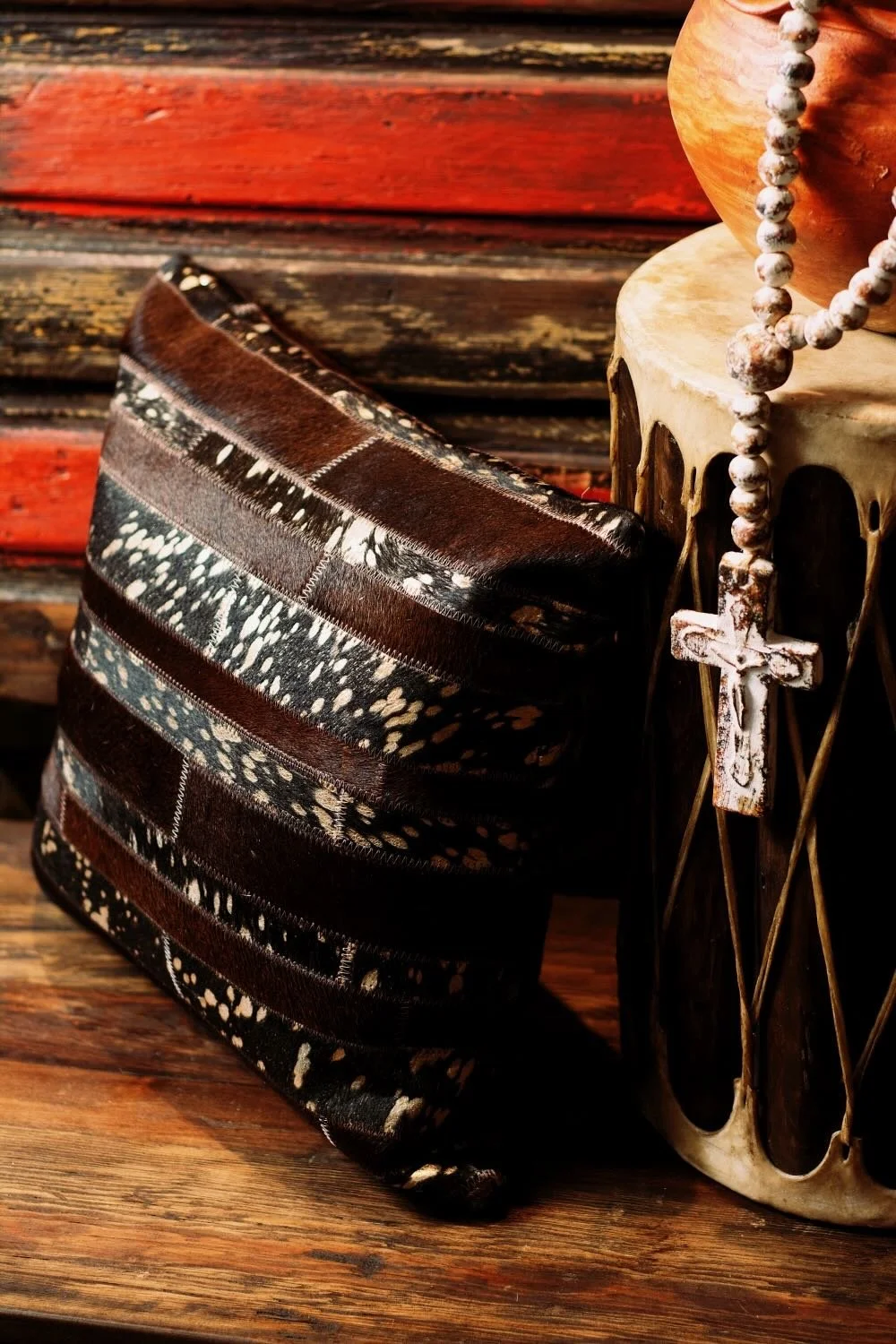 Shop a handmade cowhide and leather pillow from Brazil. Rustic luxury accent pillow with unique patterns for sofas, chairs, and home decor.