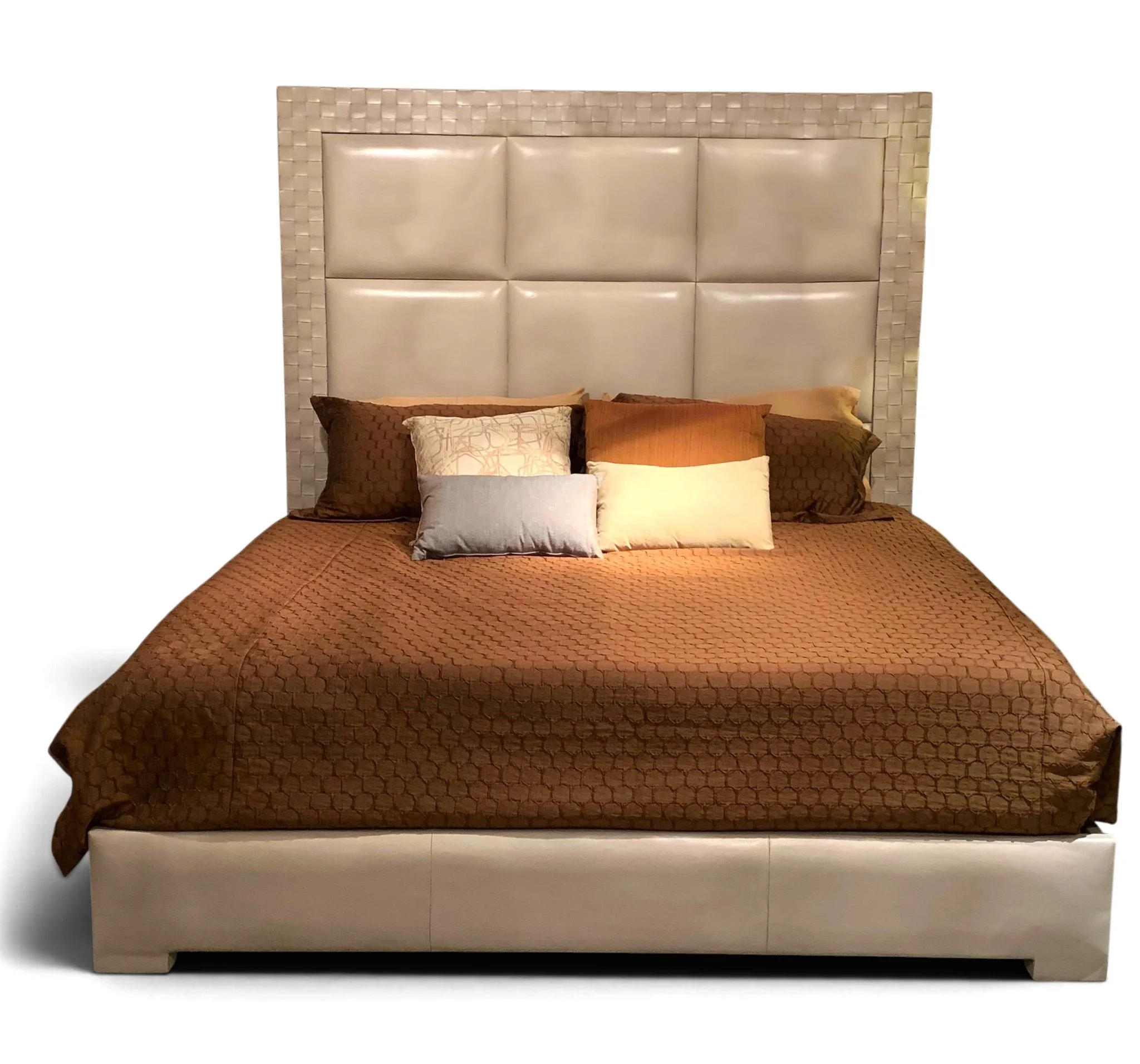 Handmade king bed with oversized leather headboard and woven leather border