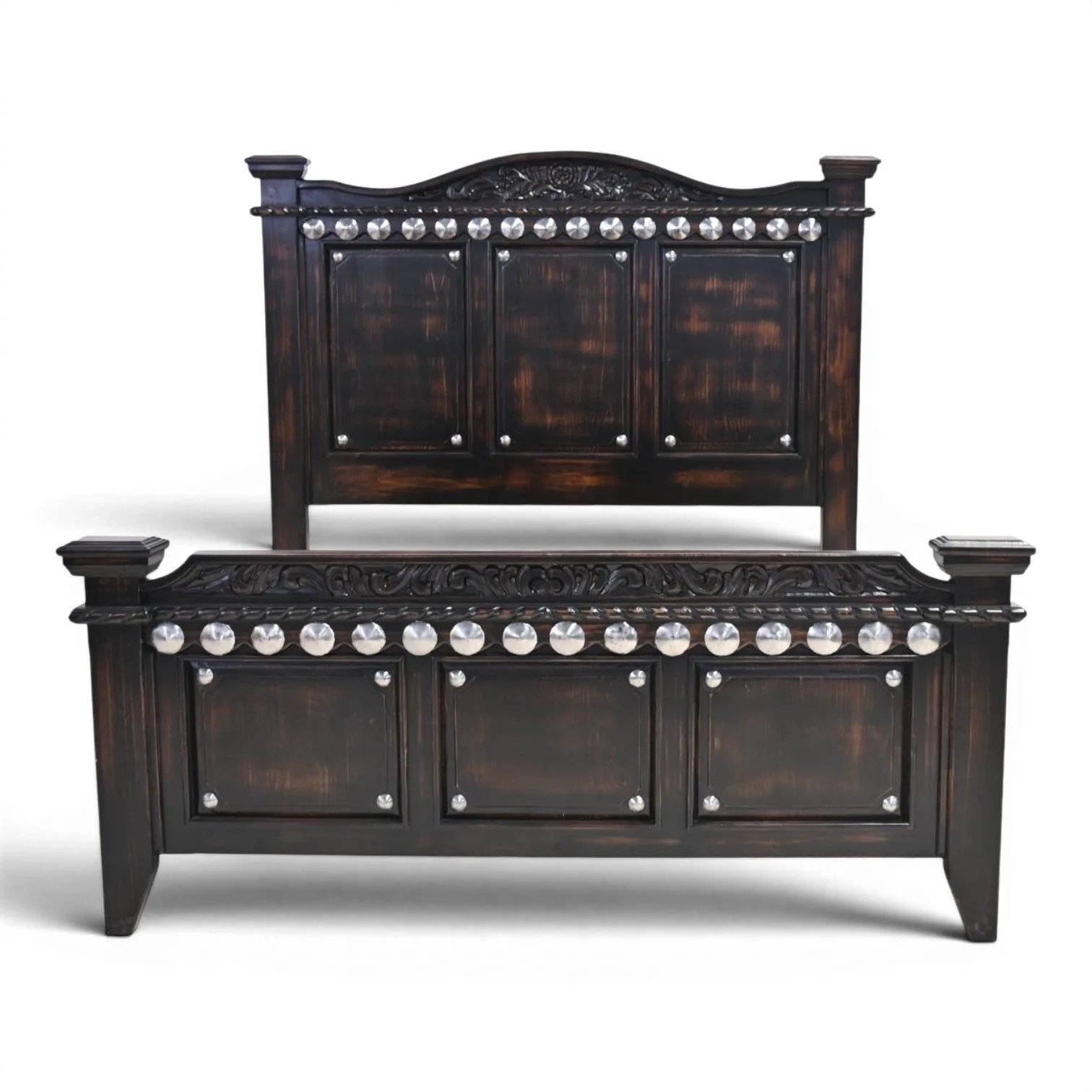 Handmade Arenas Negras bed with distressed black finish, hand-carved details, and silver clavos accents