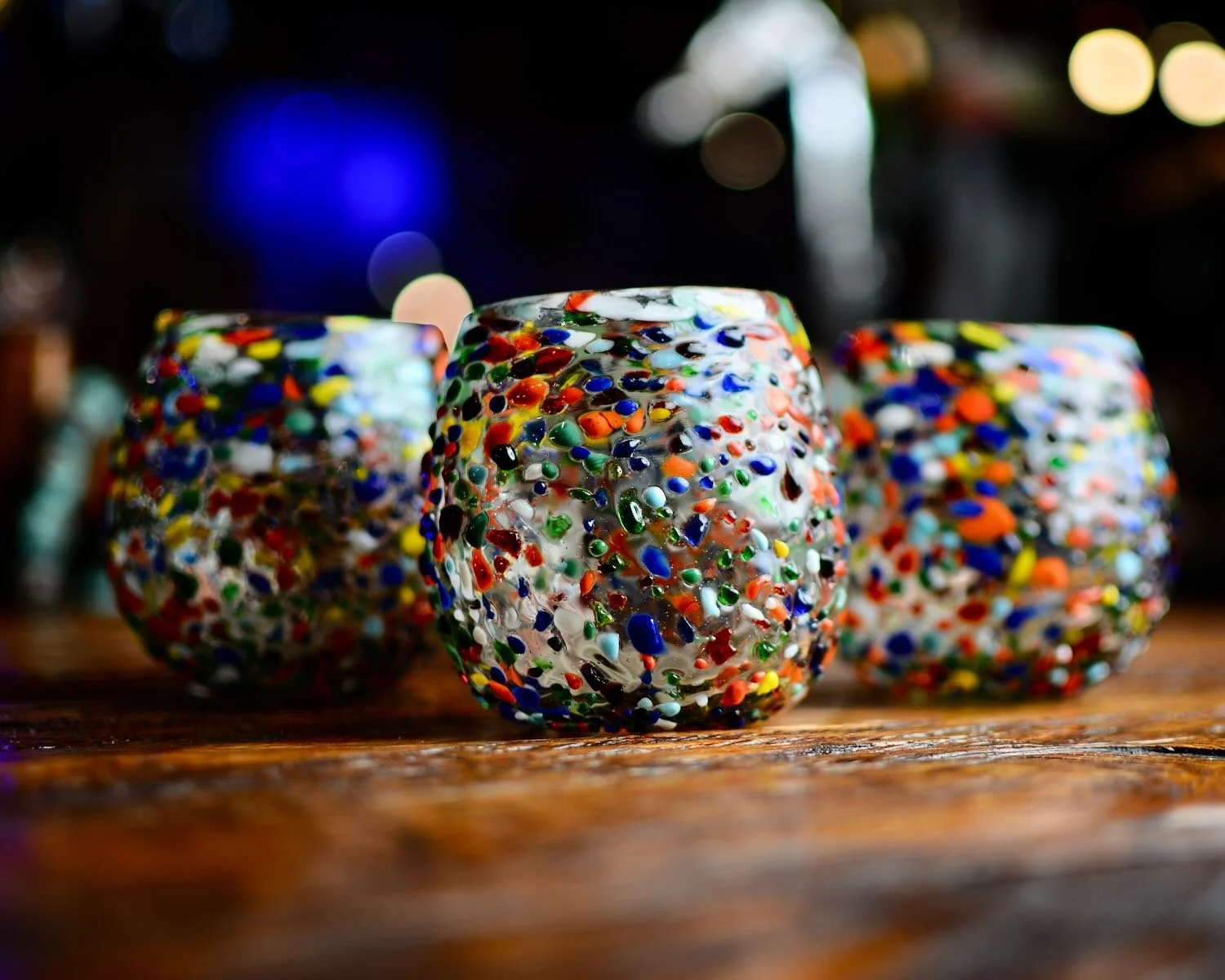 Handblown Mexican Guanajuato confetti glass with rounded base and colorful artisan finish.