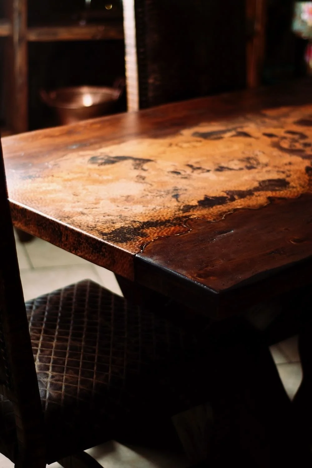 Hand pounded copper river dining table from Mexico.