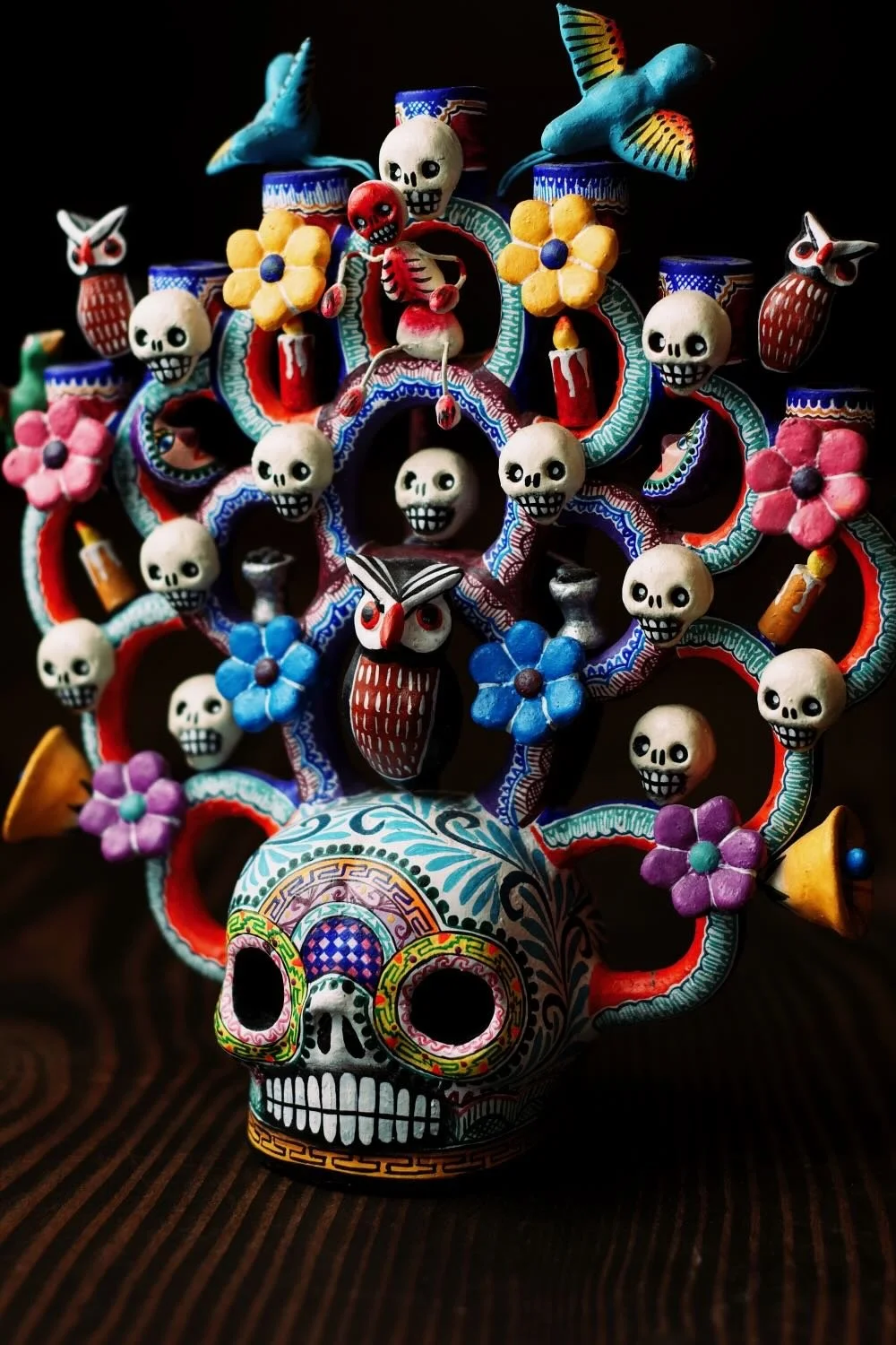Shop a handmade Day of the Dead Tree of Life from Mexico. Colorful clay folk art with skulls, flowers, and candle holders for unique decor.