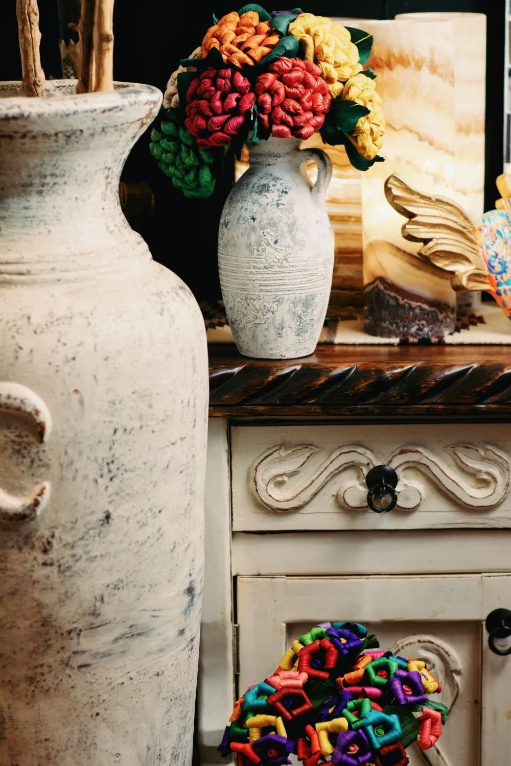 Handmade white furniture & decor with colorful cornhusk flowers from Mexico - Milagros Rústicos