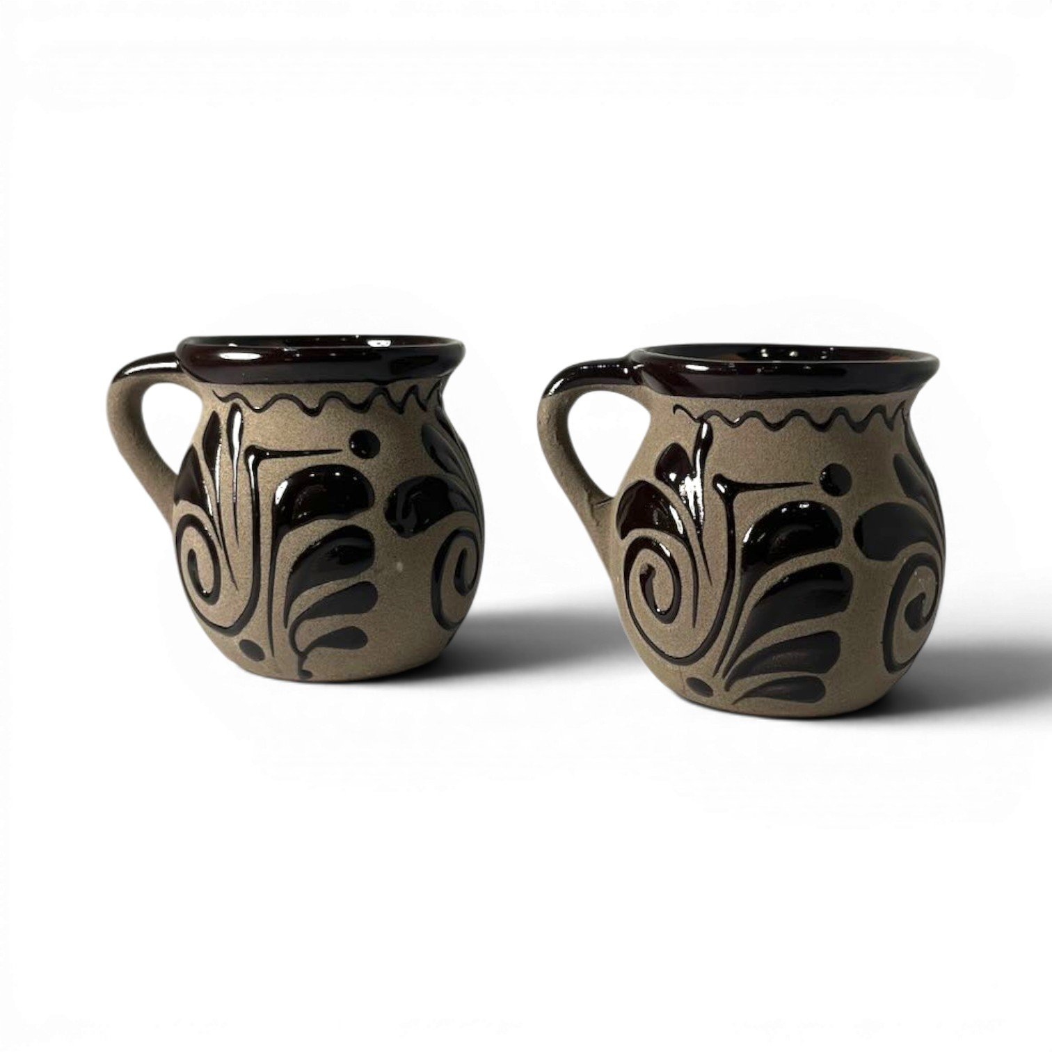 Handmade Mexican cocoa clay mug set with glazed rims and artisan interior and exterior design.