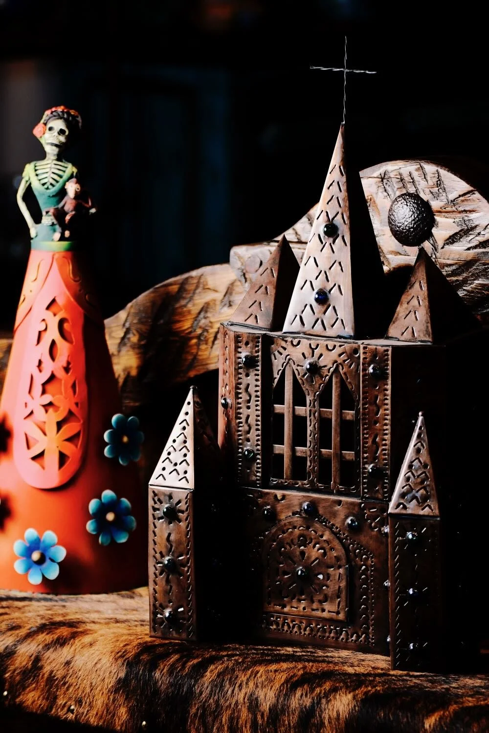 Handmade Bronze Cathedral Lamps and Metal Catrina Doll on a Cowhide Bench from Mexico