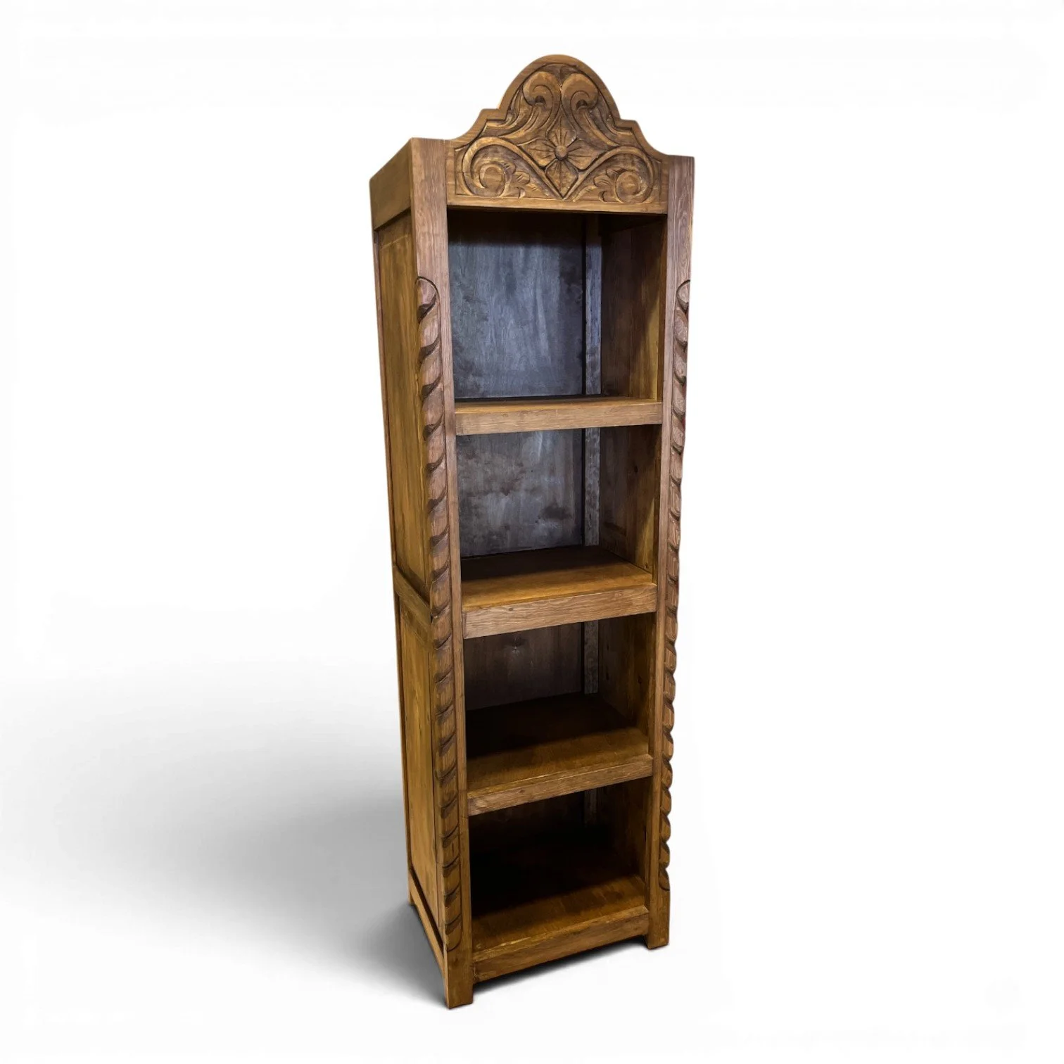 Bisbee carved solid wood bookcase handmade in Mexico with intricate detailing and spacious rustic shelving.