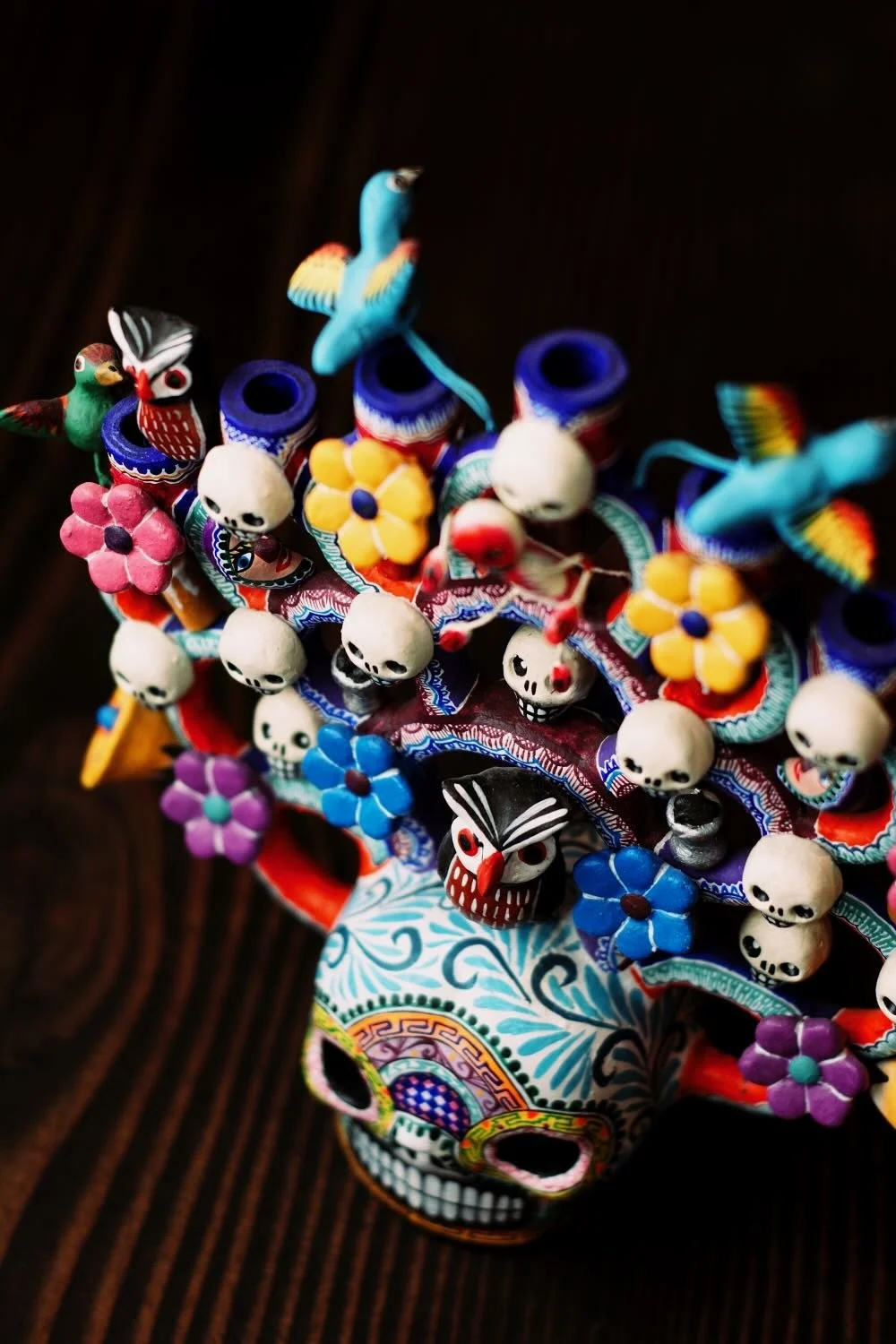 Shop a handmade Day of the Dead Tree of Life from Mexico. Colorful clay folk art with skulls, flowers, and candle holders for unique decor.