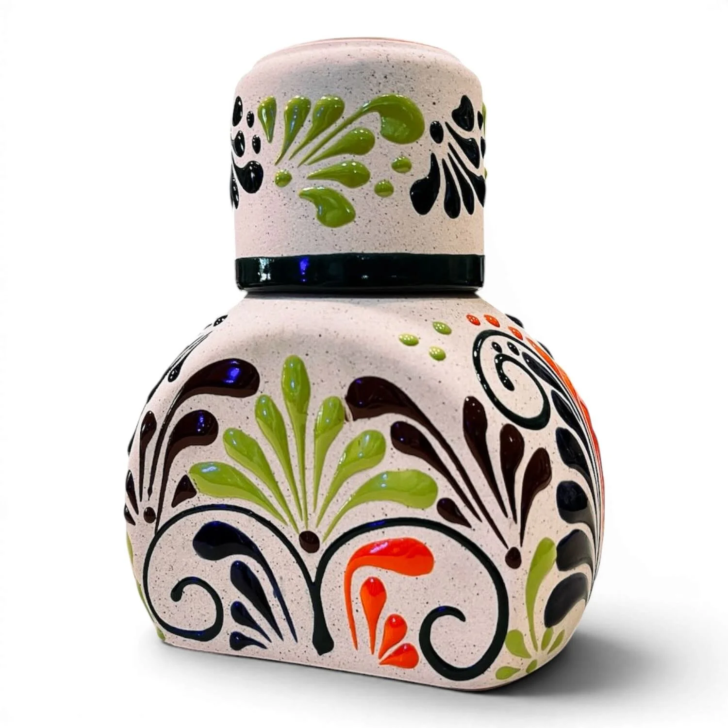 Handmade Mexican stone tequila bottle and matching shot cup with colorful hand-painted design