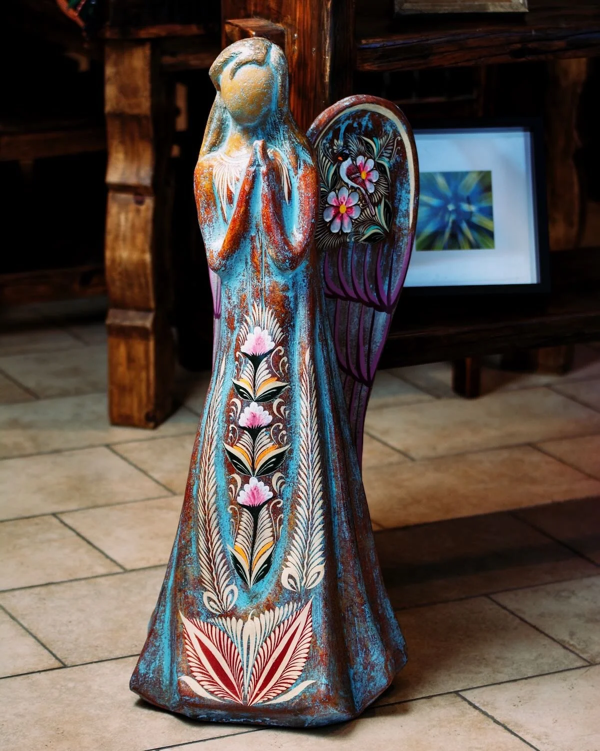 Colorful clay angel praying handcrafted from Mexico.