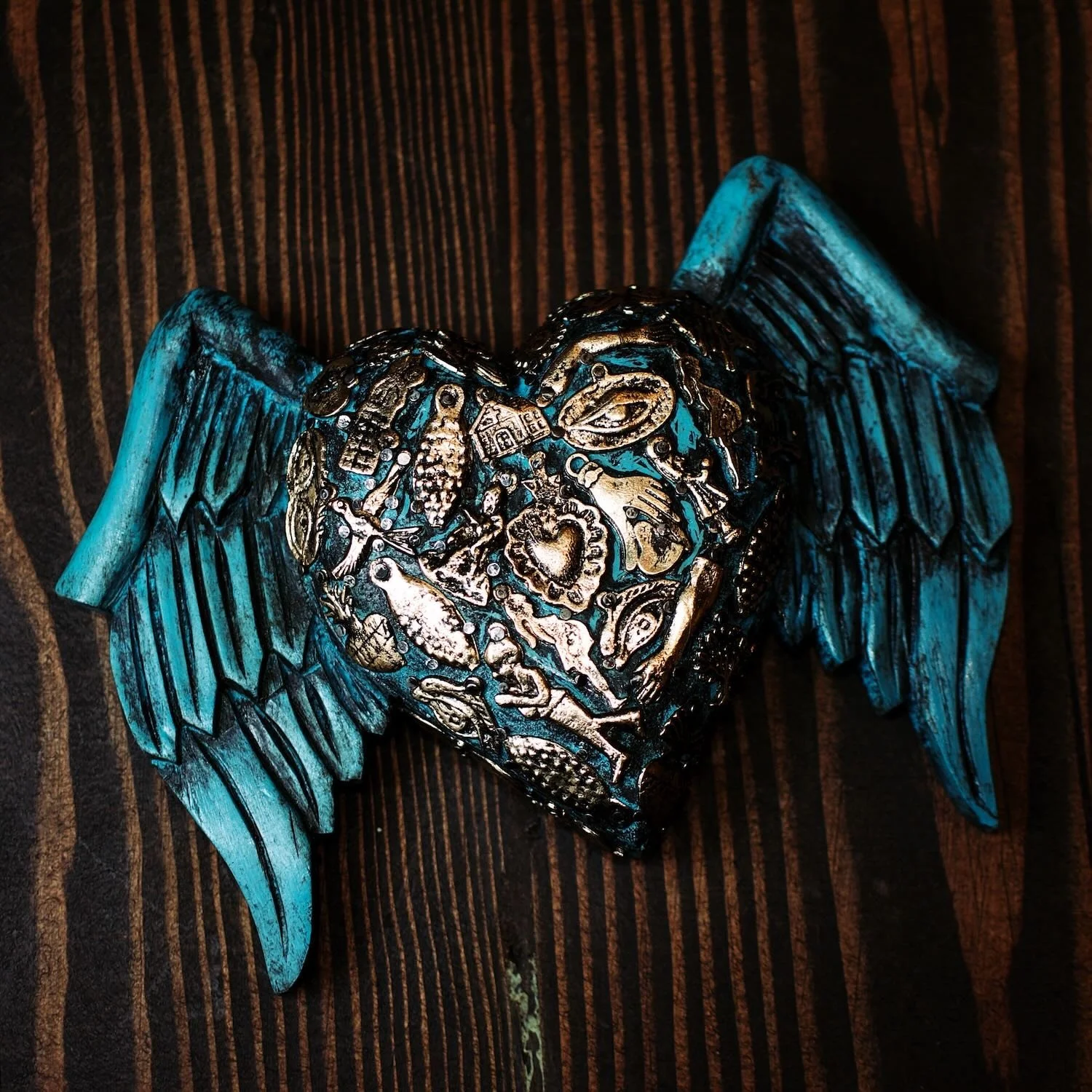 Handmade Mexican blue angel wings wall décor with traditional silver milagros charms.