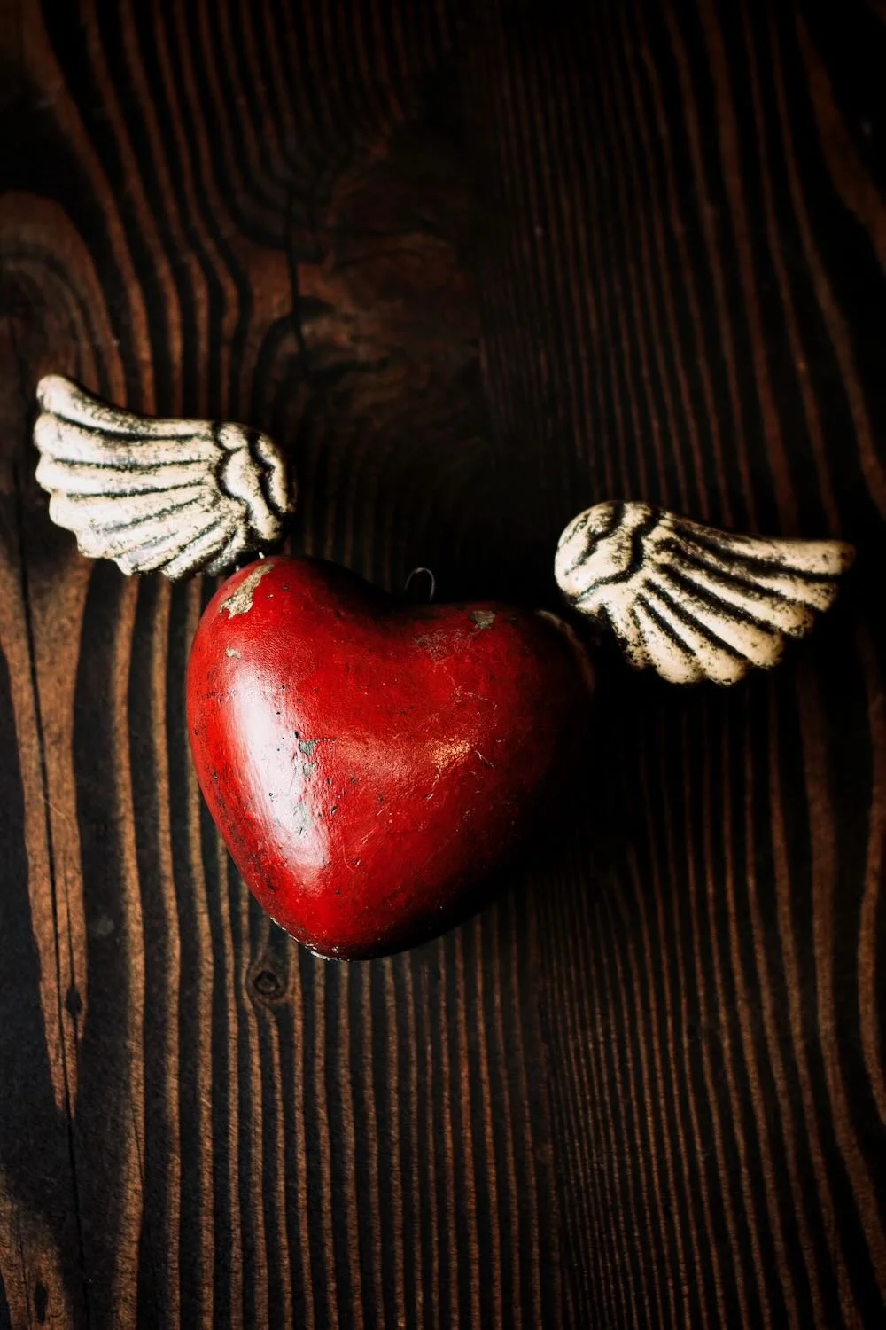 Shop a handmade sacred heart with wings from Mexico. Unique clay decor with spiritual symbolism and artisan craftsmanship for home accents.