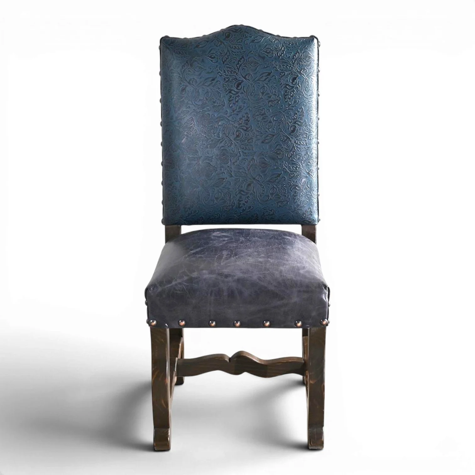 Handmade San Lucas cobalt blue leather dining chair with embossed leather back, nailhead trim, and dark wood frame crafted in Mexico.