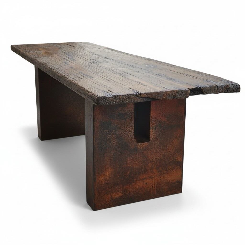 Handmade Guaymas dining table with distressed dark wood top and hand-pounded natural copper pedestal base crafted in Mexico.