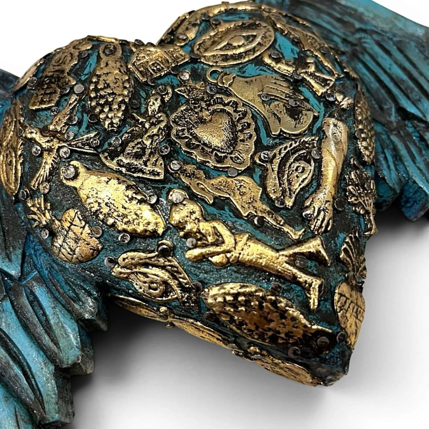 Handmade Mexican blue angel wings wall décor with traditional silver milagros charms.