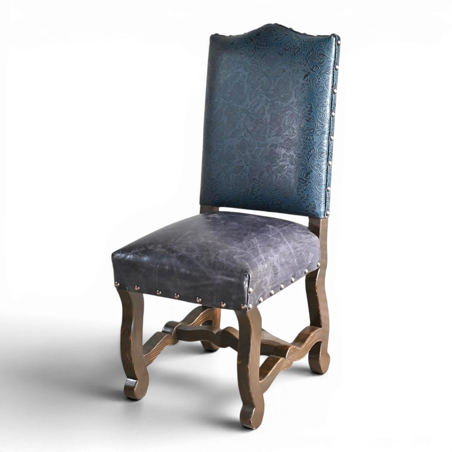 Handmade San Lucas cobalt blue leather dining chair with embossed leather back, nailhead trim, and dark wood frame crafted in Mexico.