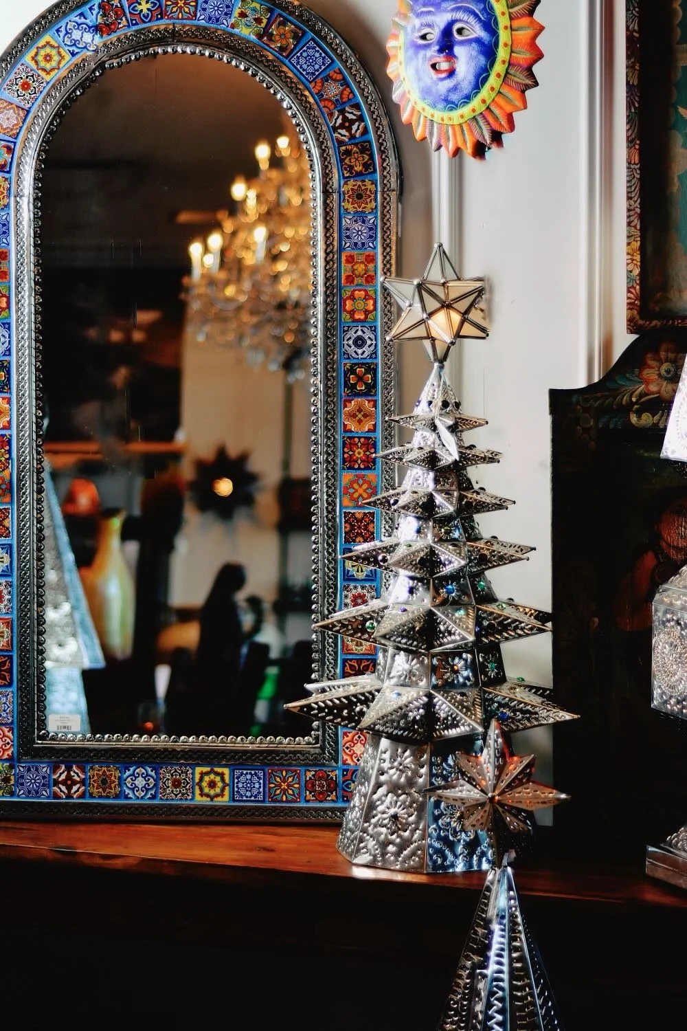 Blue grouted Talavera tile mirror and handmade lighted Christmas trees from Mexico.