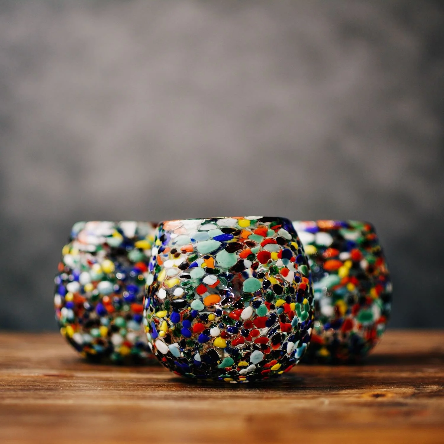 Handblown Mexican Guanajuato confetti glass with rounded base and colorful artisan finish.