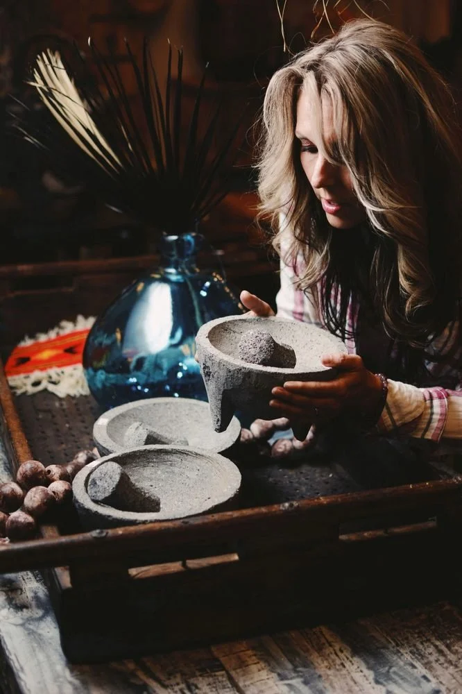 Pretty girl with authentic lava stone molcajetes from Mexico.