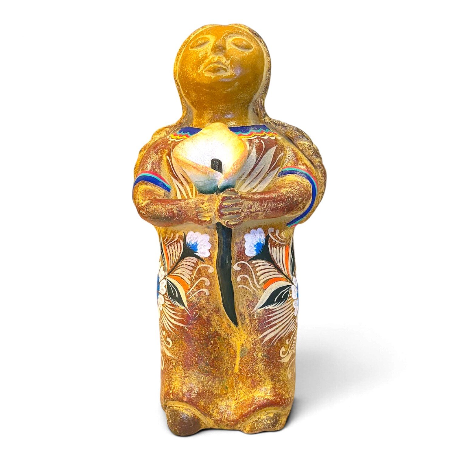 Handmade Mexican clay figure of a woman holding a calla lily