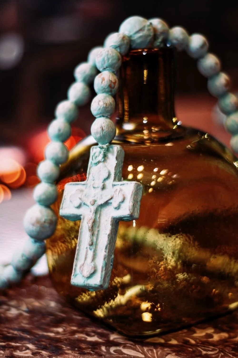 Rosario de Barro - Turquesa. Handcrafted 27" turquoise clay rosary from Milagros Rústicos. Features a distressed finish. Ideal for home altars or rustic decor.