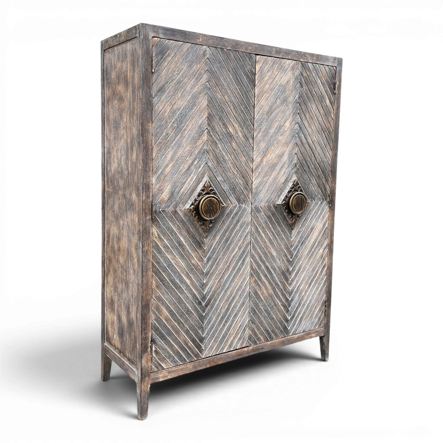 Matucana handmade Peruvian solid wood armoire with chevron-pattern doors, decorative brass handles, and rustic design.