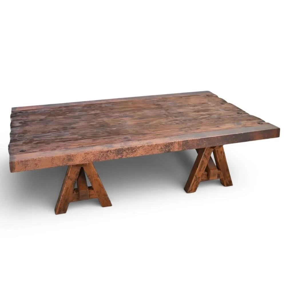 Handmade Floresville copper edge coffee table with A-frame base, distressed wood top, and clavos accents.