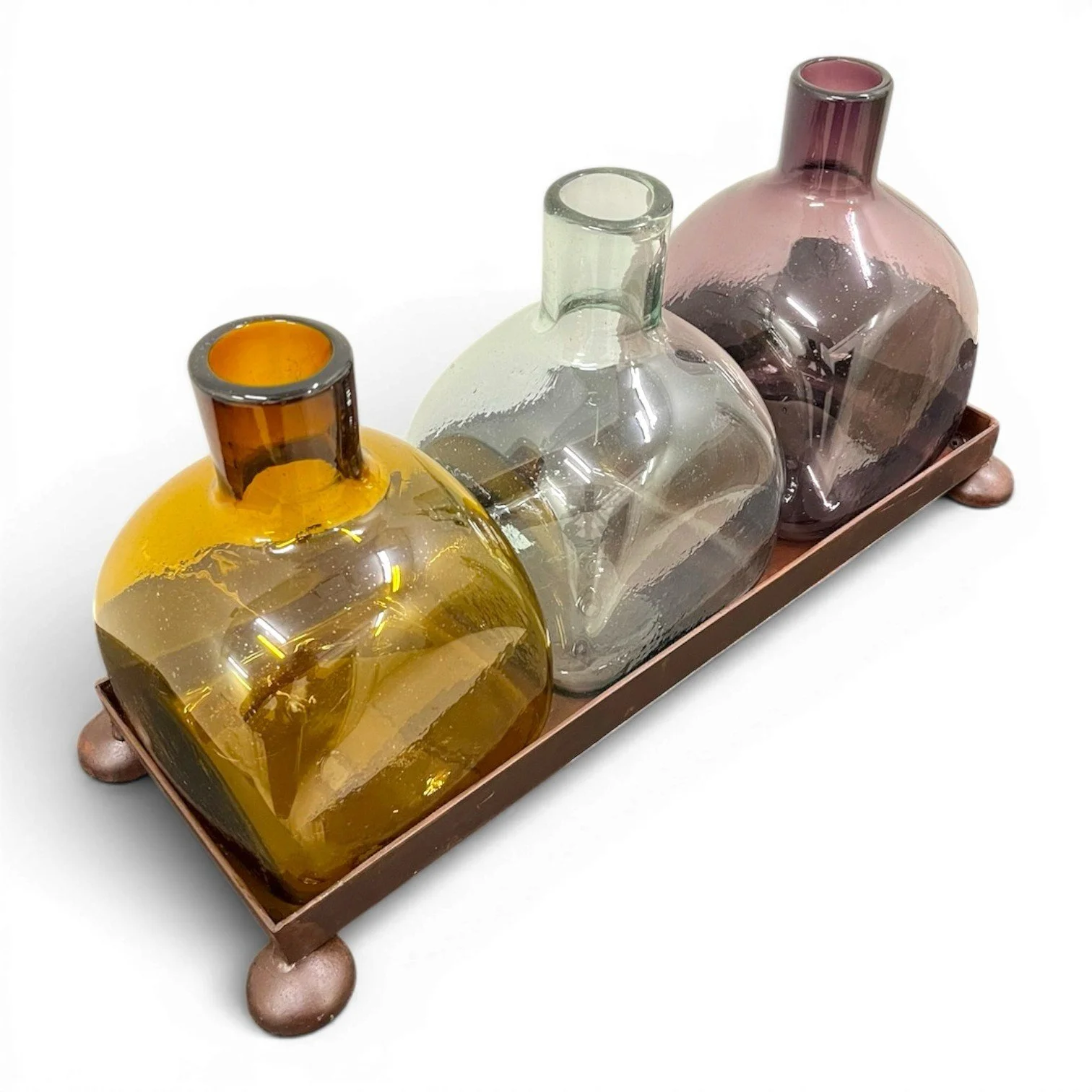 Handmade Mexican serving set featuring three handblown glass bottles and a handcrafted iron tray, perfect for entertaining and rustic décor.