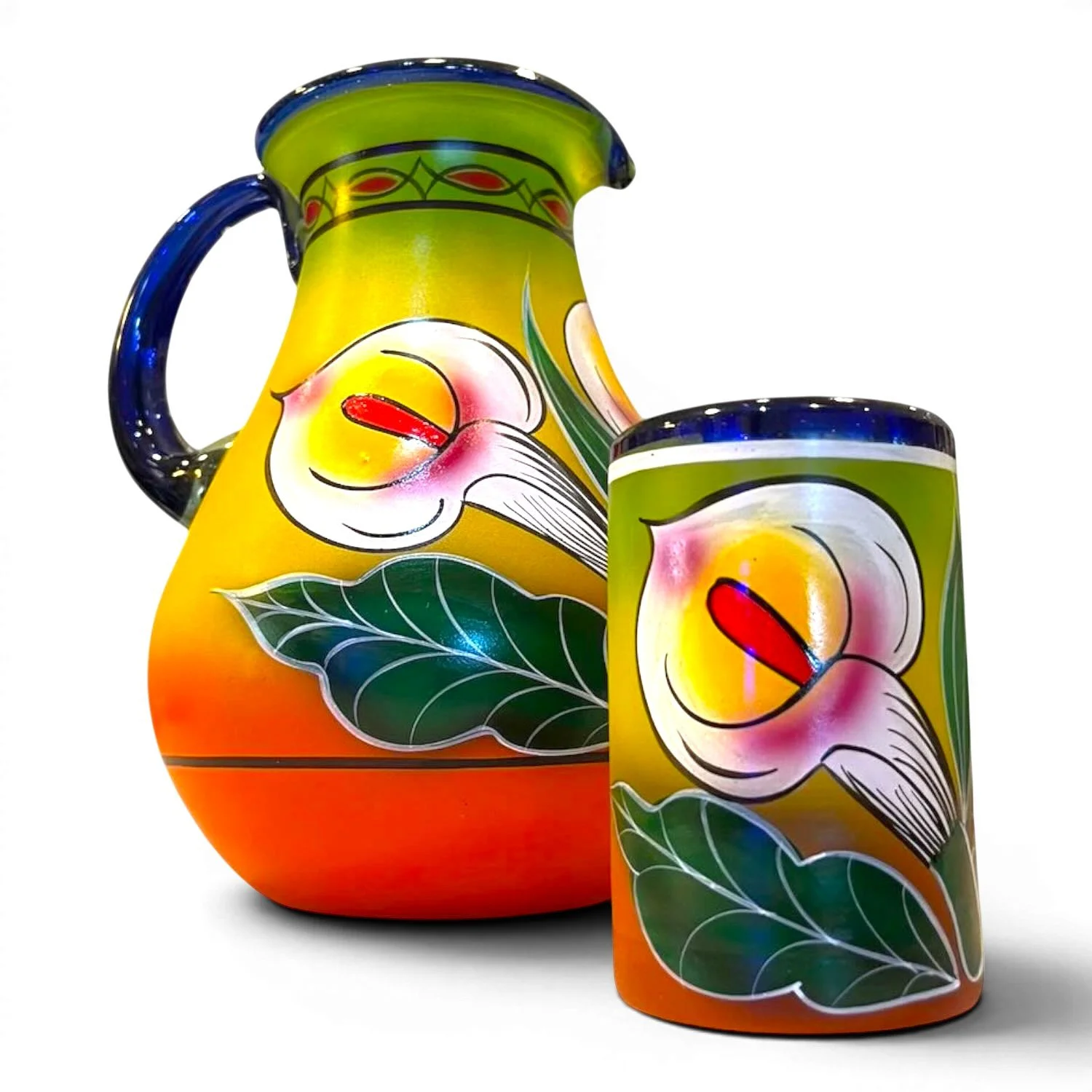 Handblown painted calla lily glass pitcher with five matching tumblers handmade in Mexico featuring blue accents and vibrant floral artwork.