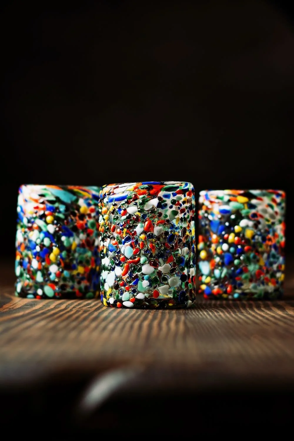 Shop a handblown Guanajuato tumbler from Mexico. Colorful confetti glassware perfect for everyday drinks, entertaining, and unique table settings.