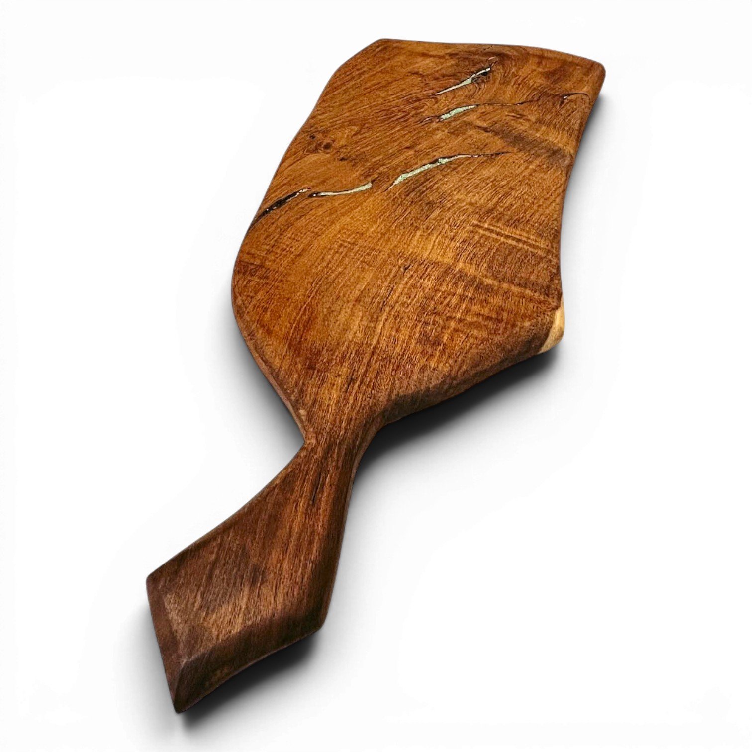 Handmade Mexican mesquite wood cutting board with turquoise inlay and natural wood grain.