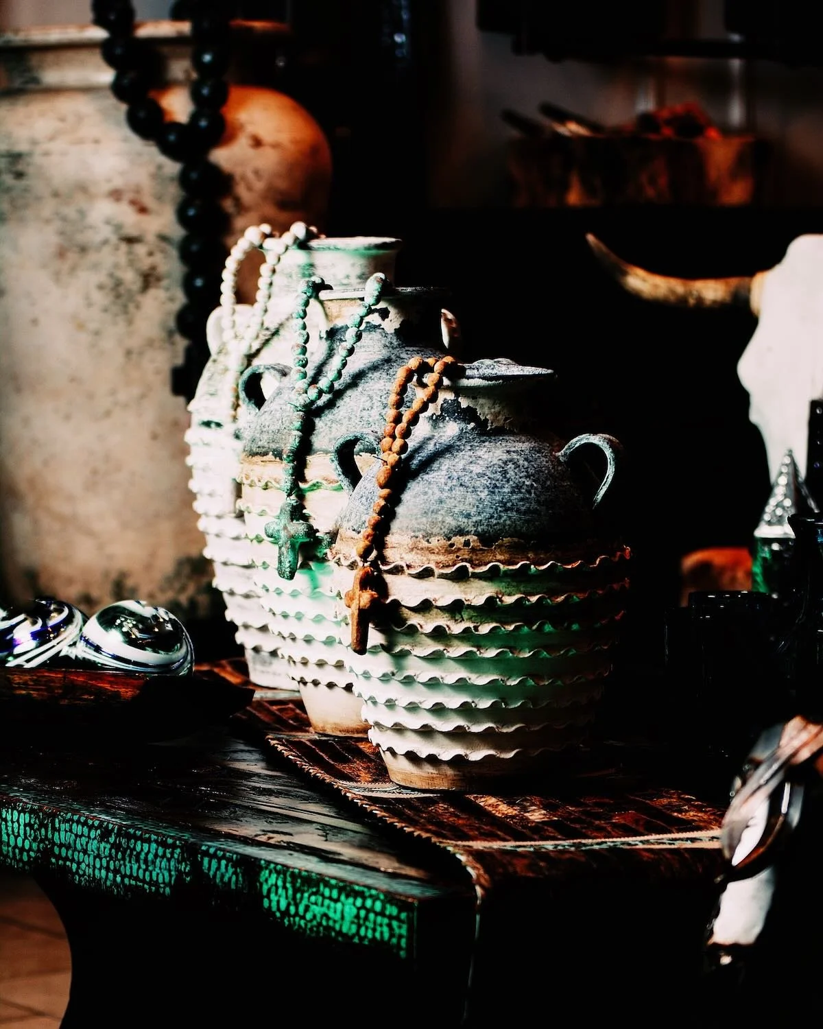 Ruffle clay vases with rosary beads from Mexico.