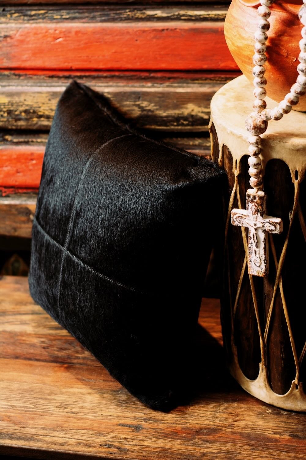 Shop a handmade cowhide and leather pillow from Brazil. Rustic luxury accent pillow with unique patterns for sofas, chairs, and home decor.