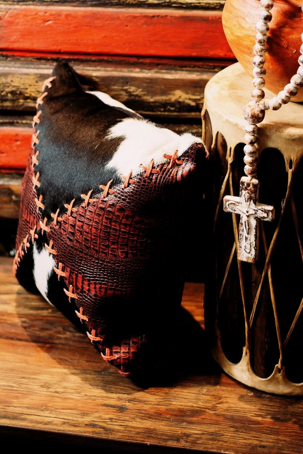 Shop a handmade cowhide and leather pillow from Brazil. Rustic luxury accent pillow with unique patterns for sofas, chairs, and home decor.
