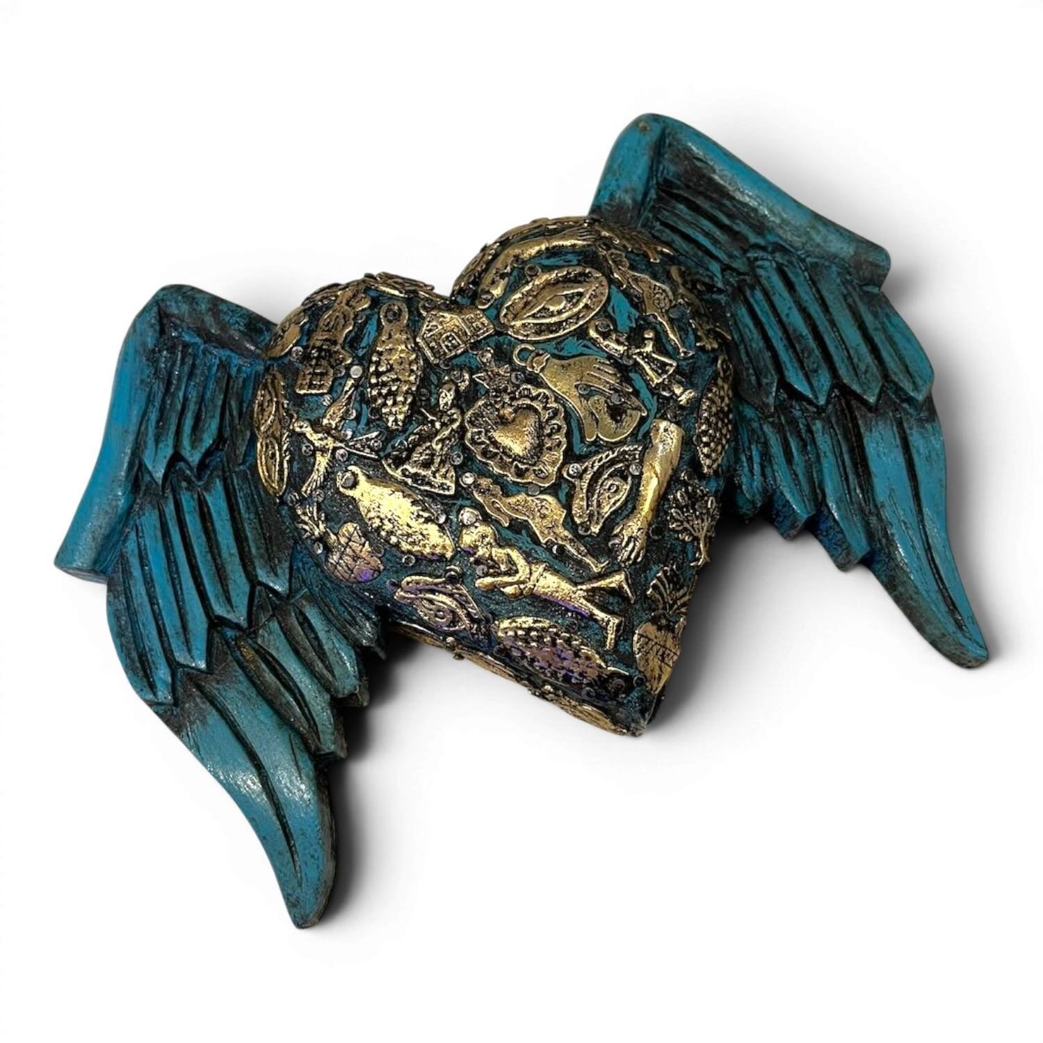 Handmade Mexican blue angel wings wall décor with traditional silver milagros charms.