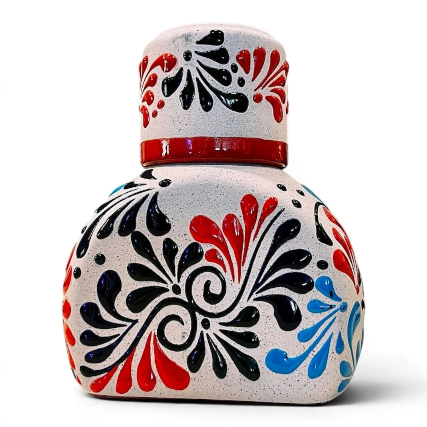 Handmade Mexican stone tequila bottle and matching shot cup with colorful hand-painted design