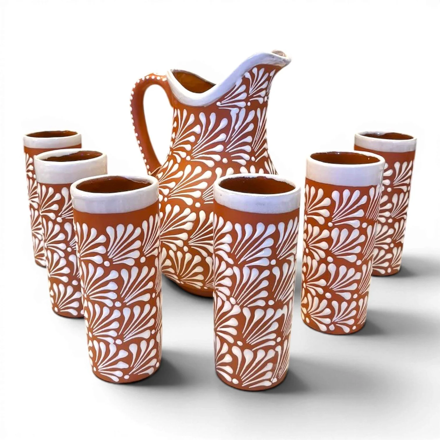Handcrafted Mexican terracotta pitcher and tumbler set with white Talavera-style design and glazed finish