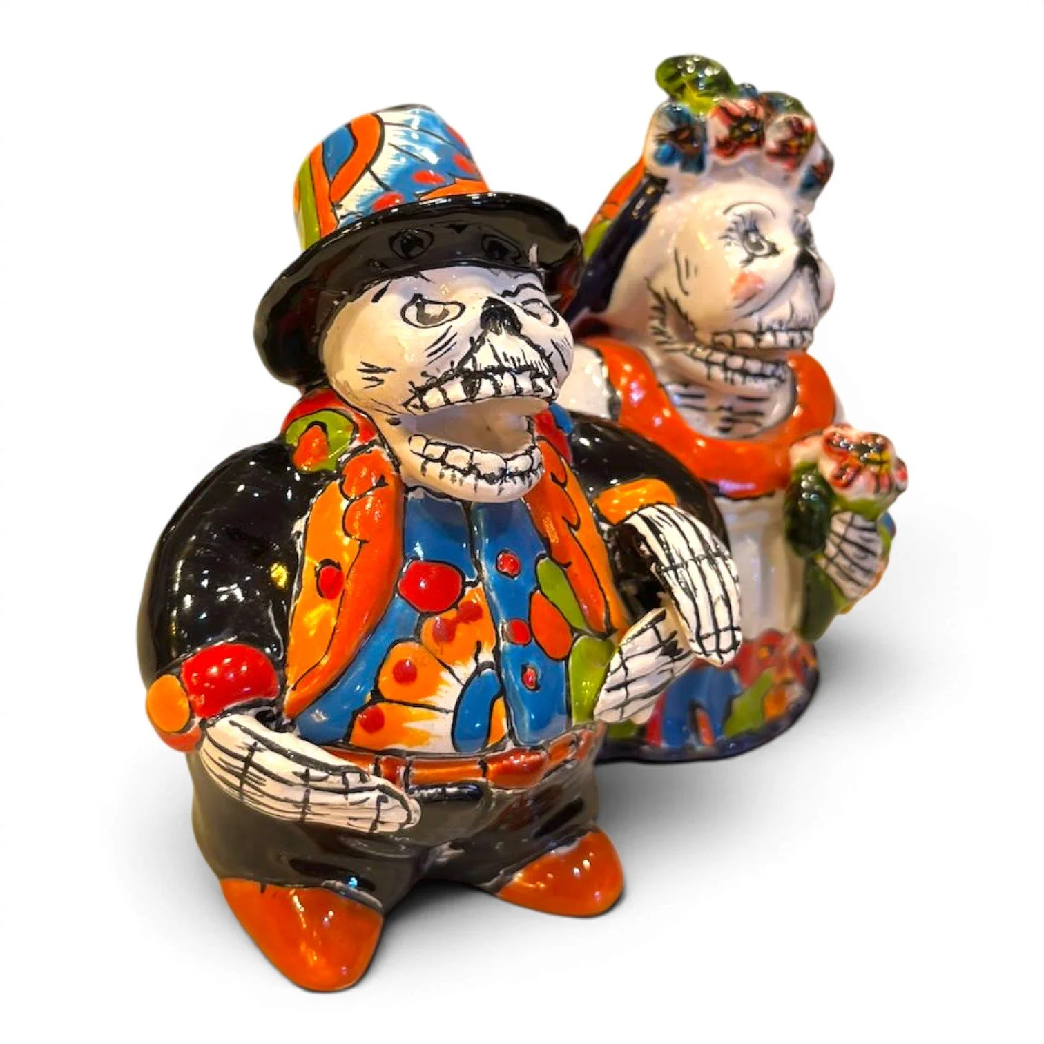Handmade Talavera figure of an elderly catrín and catrina couple, vibrant hand-painted colors