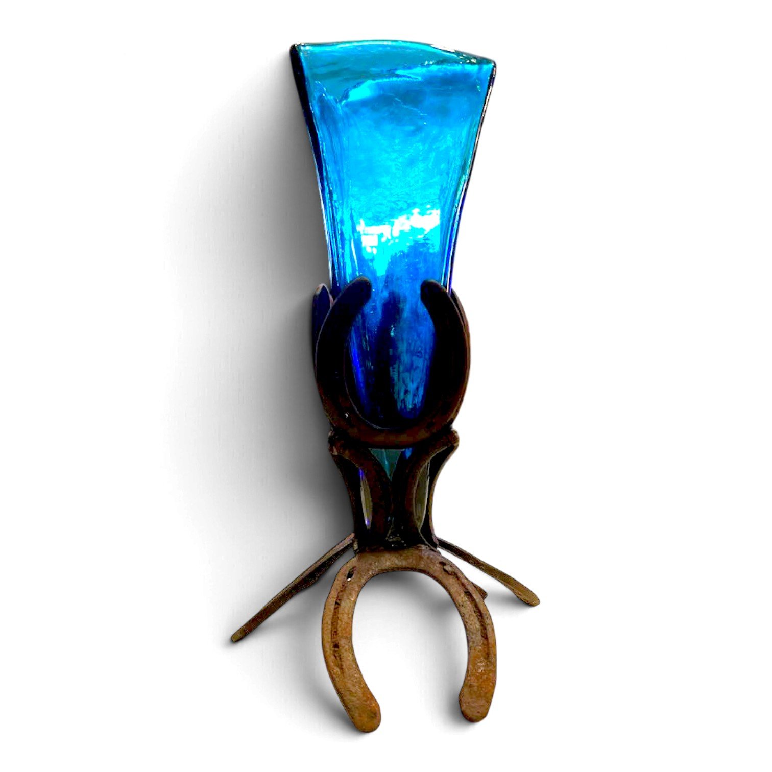 Handmade horseshoe candelabra with turquoise hand-blown glass candle holder
