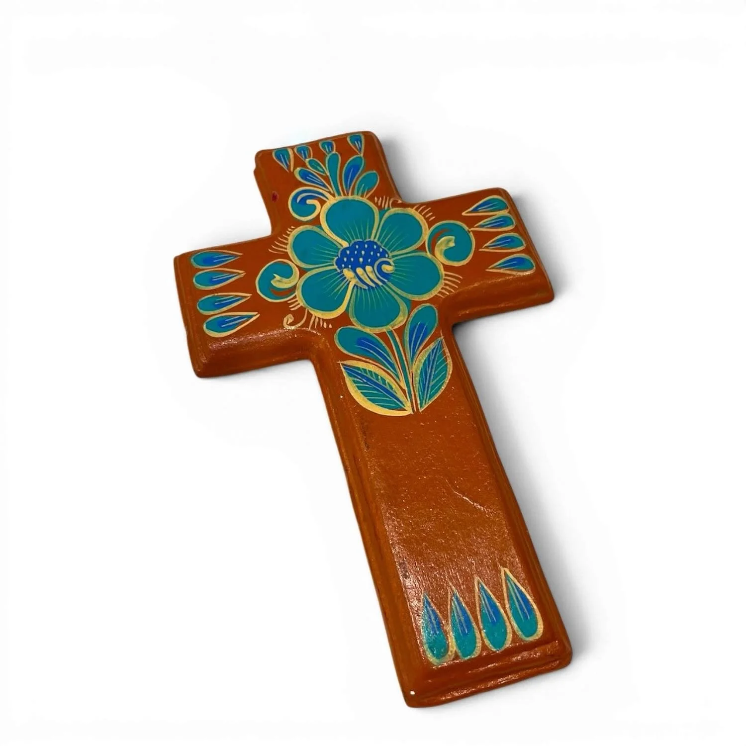 Handmade clay painted cross from Mexico with colorful terracotta and turquoise floral design.