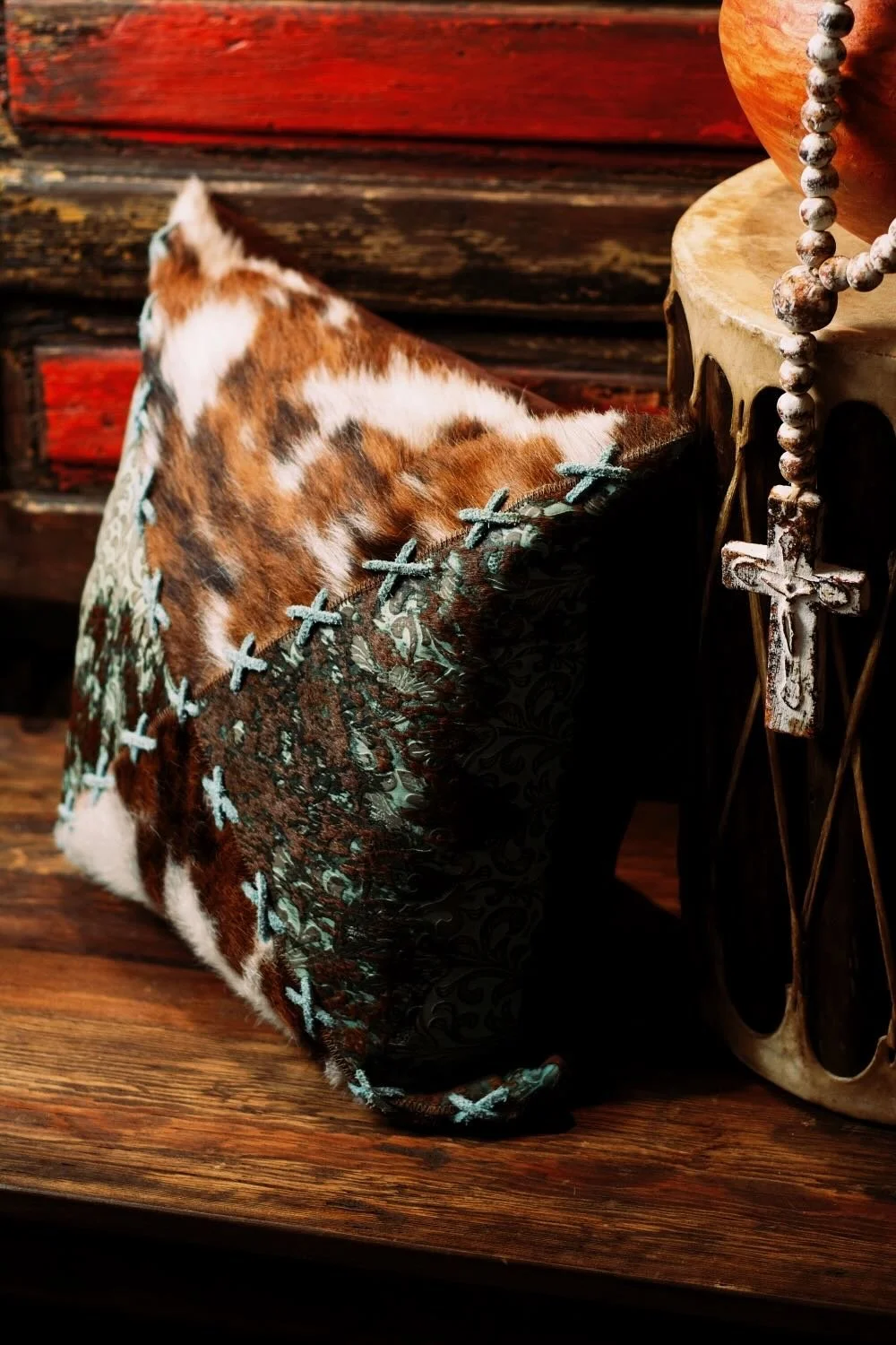 Shop a handmade cowhide and leather pillow from Brazil. Rustic luxury accent pillow with unique patterns for sofas, chairs, and home decor.
