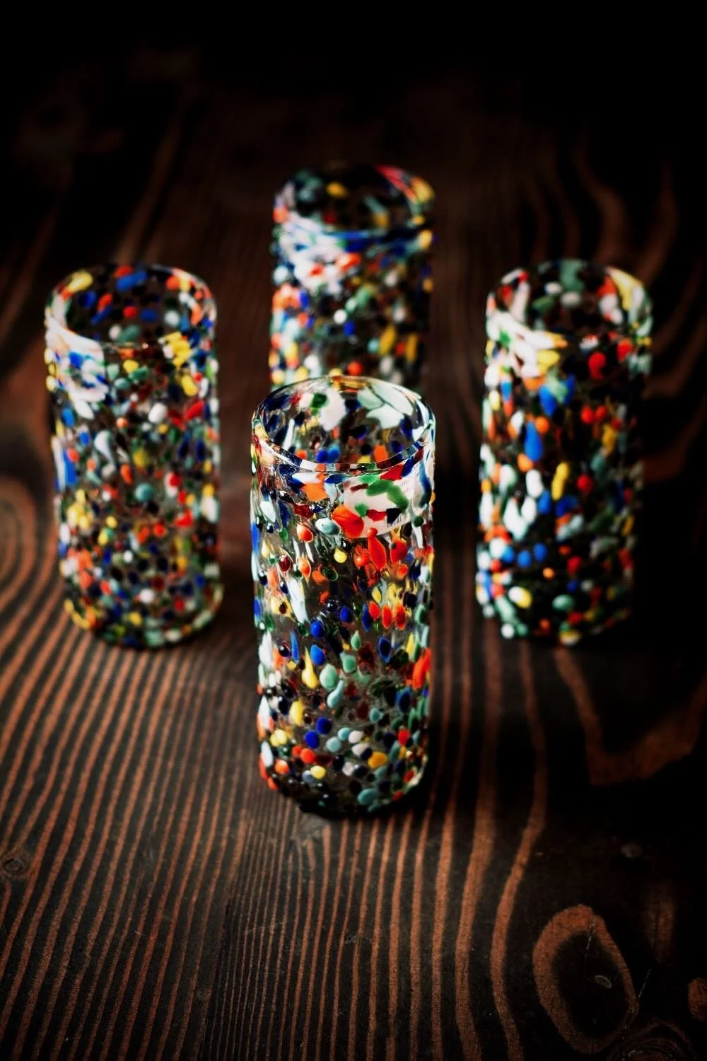 Shop a handblown Guanajuato Collins glass from Mexico. Colorful confetti design artisan drinkware perfect for cocktails and entertaining.