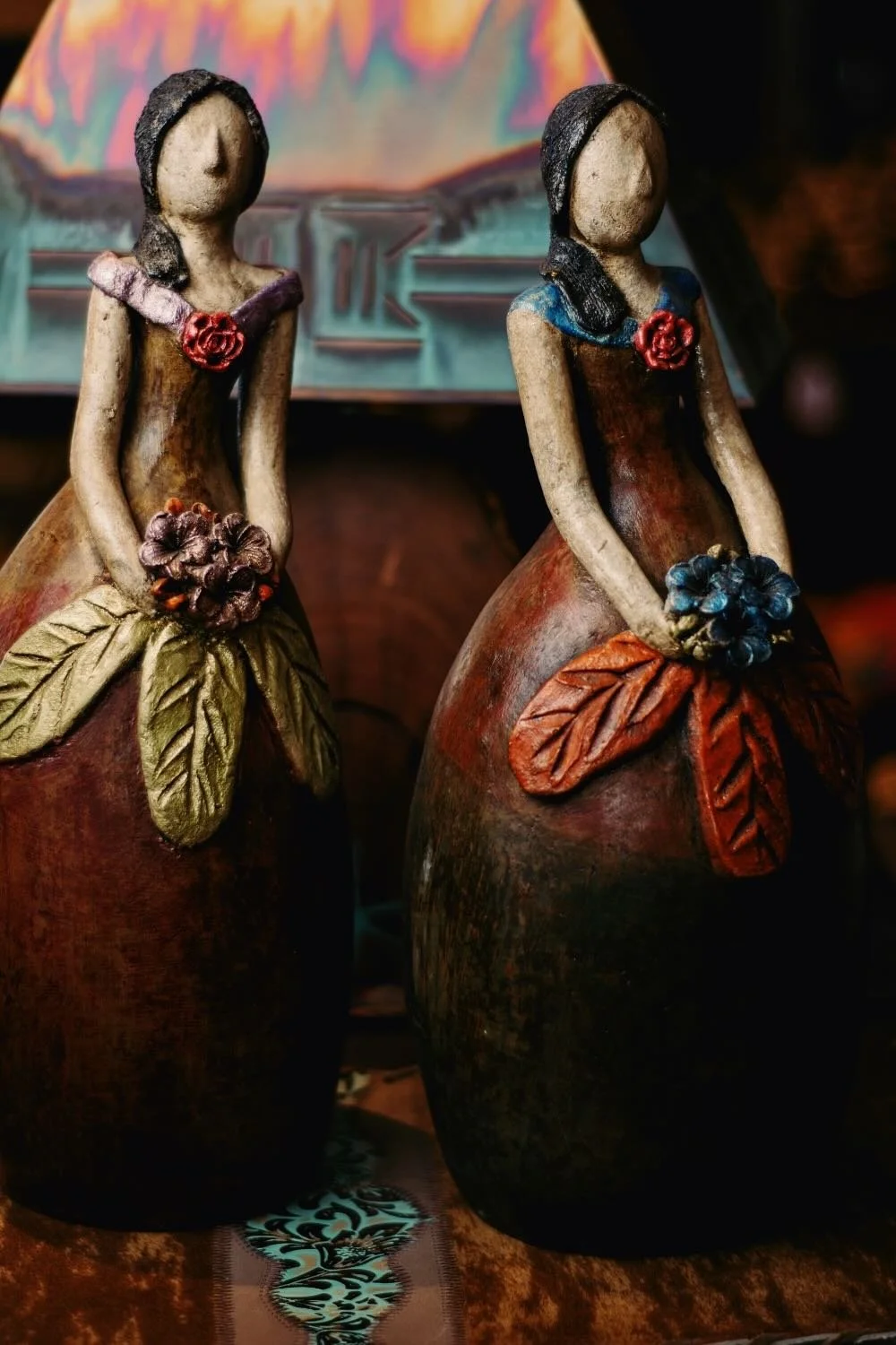 Handmade clay ladies with flowers from Mexico.