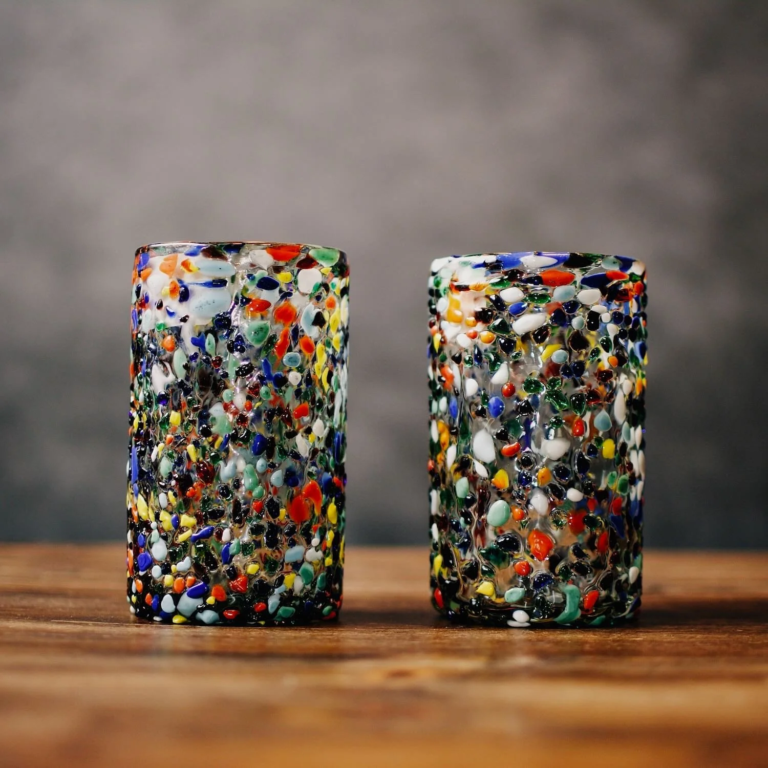 Handblown Mexican Guanajuato tall tumbler with colorful confetti glass and textured artisan finish.